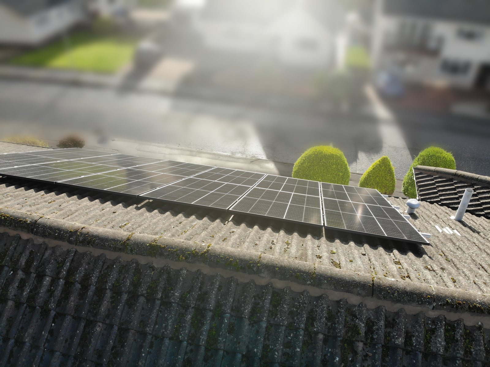 Drone shot looking down the lower row of panels along the roof edge